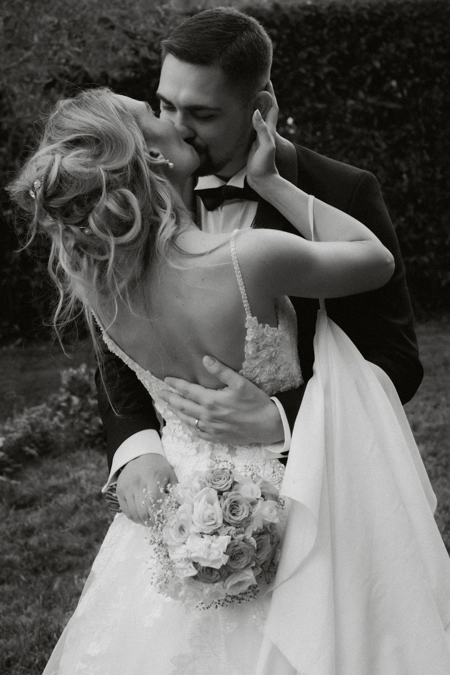 Artistic black and white wedding photography sequence capturing romantic dance moments.