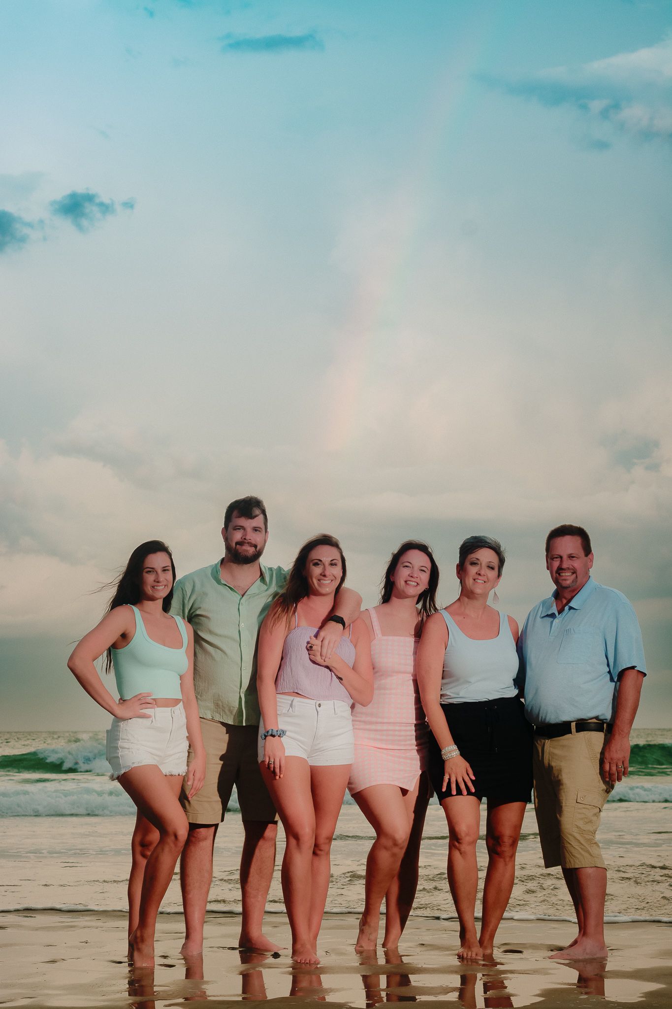 Beach family photo with rainbow