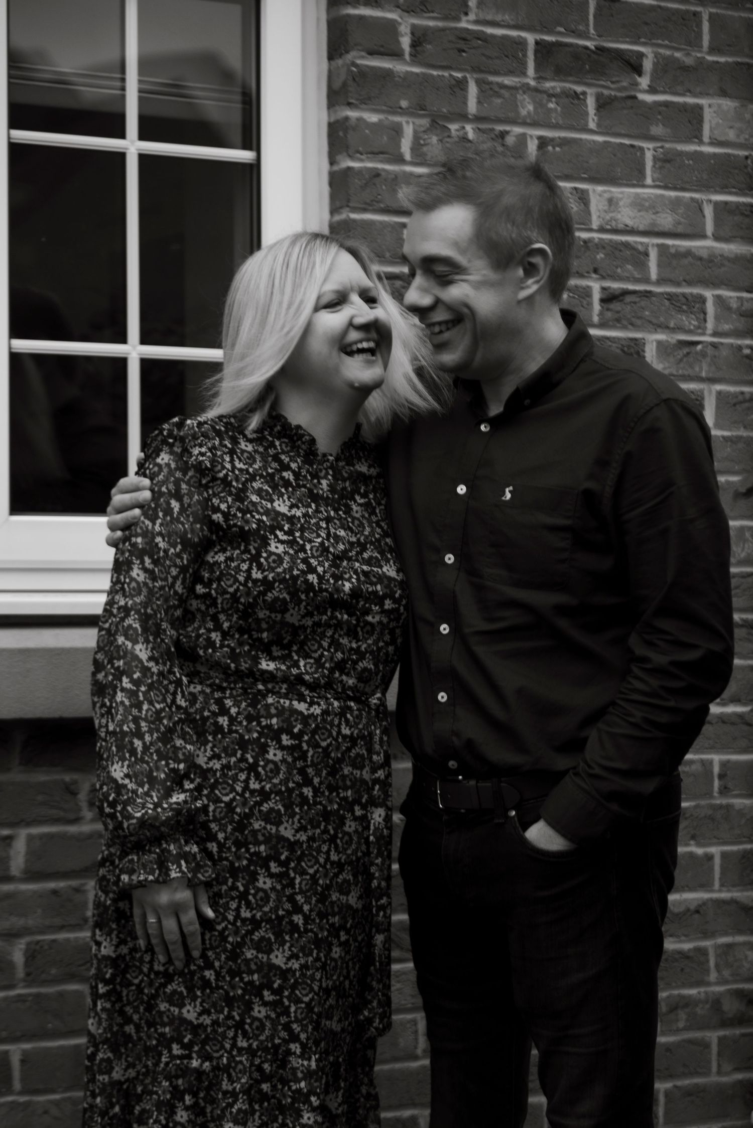 Happy mum and dad smiling at each other