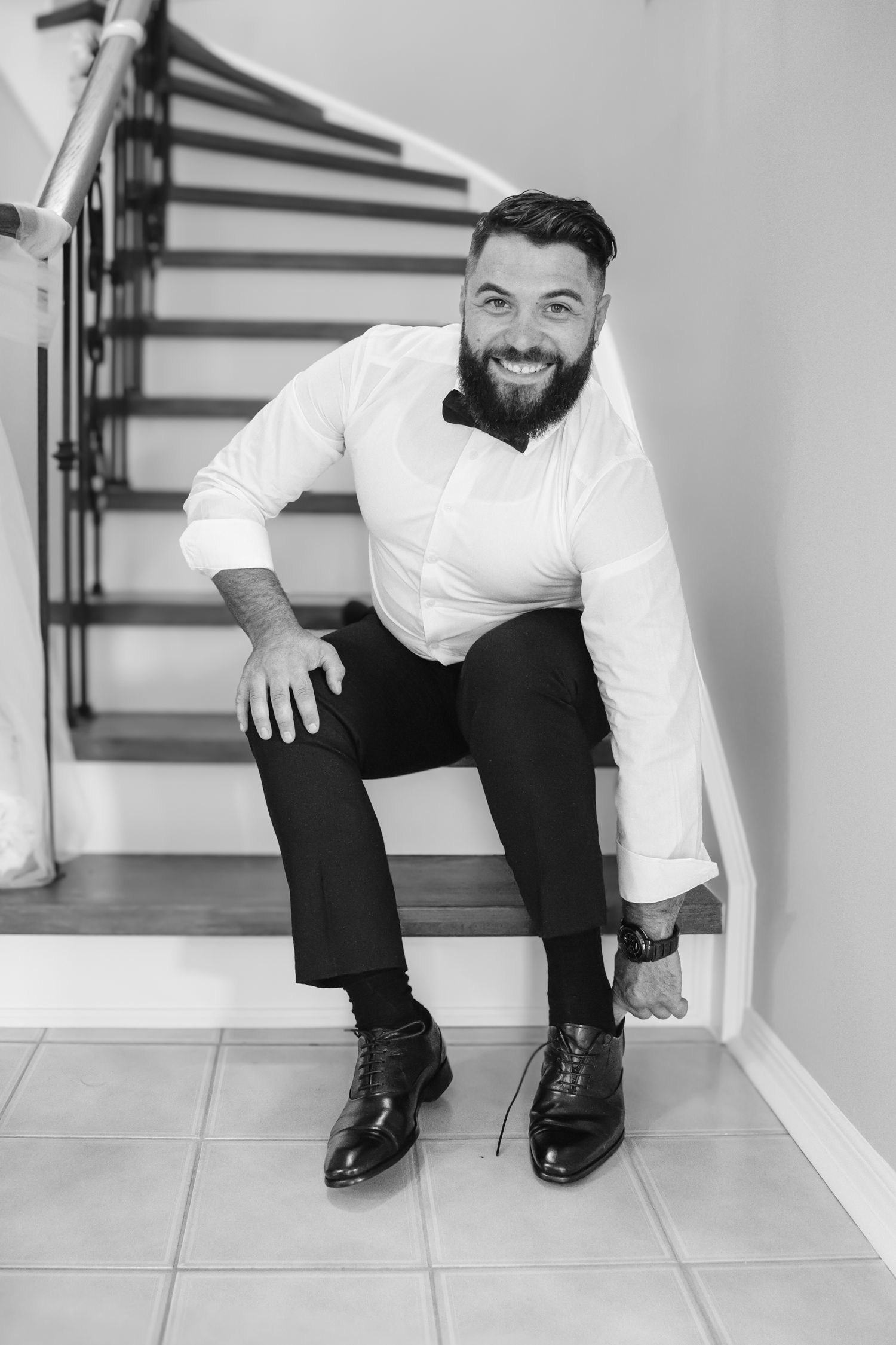 Groom Putting On Shoes in Toronto