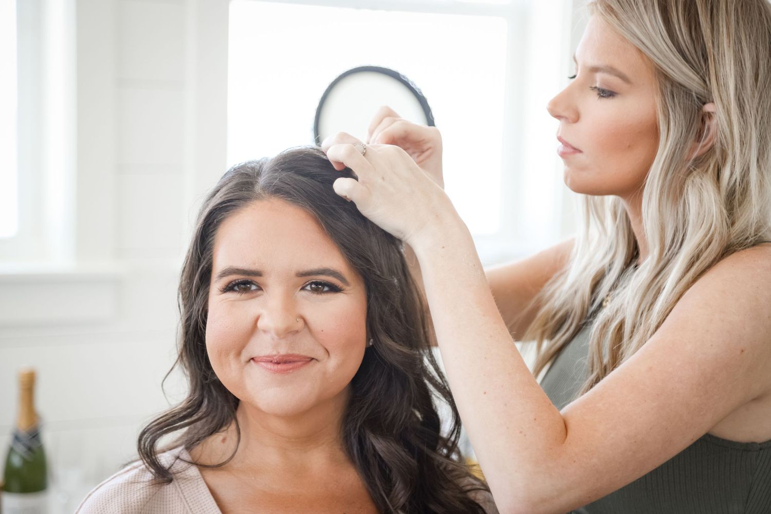Hair styling preparation scene in a bright, natural light filled room.