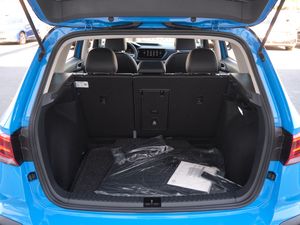 Spacious cargo area of a Volkswagen Taos with floor mats visible.