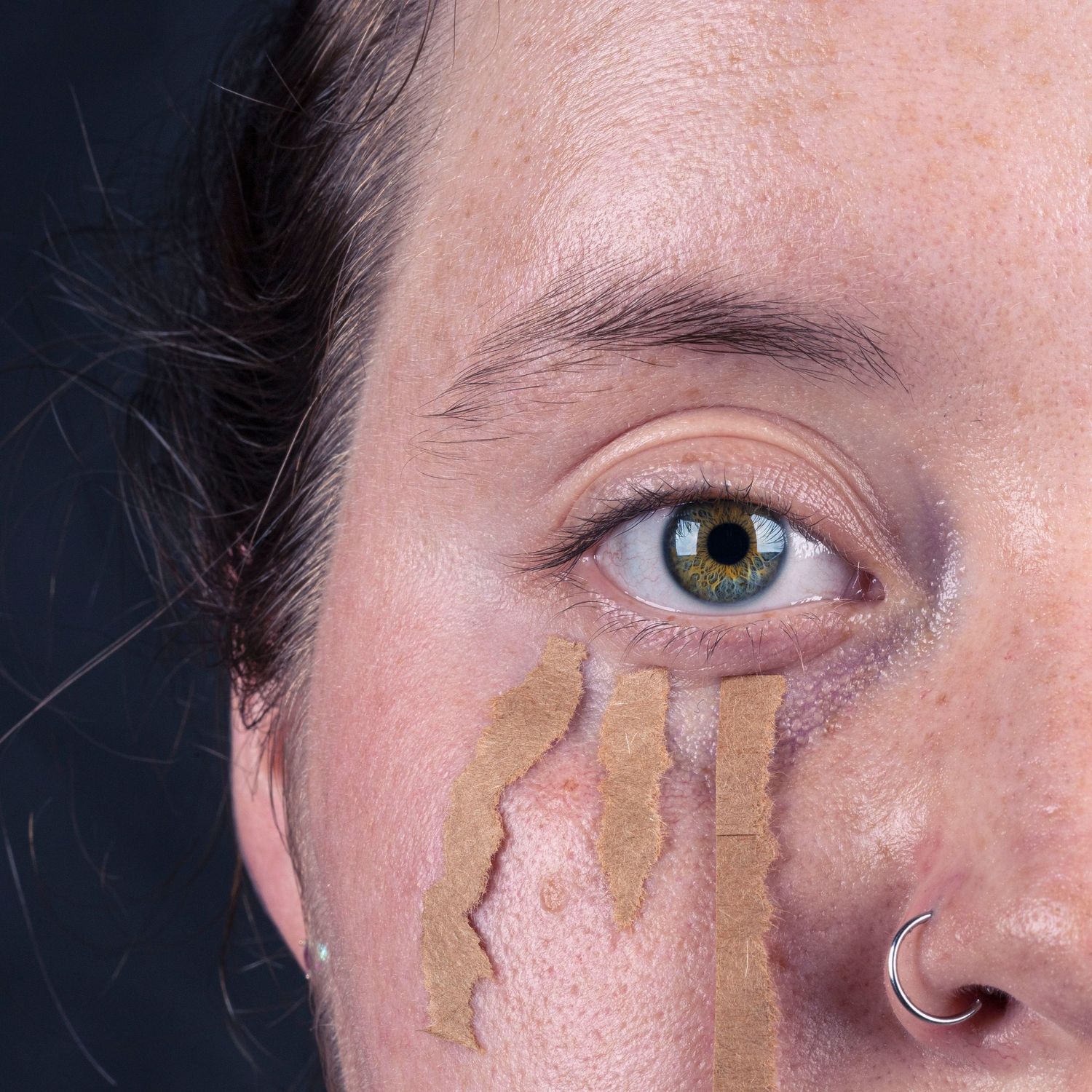 Close-up macro shots showing skin texture with gold leaf applications.