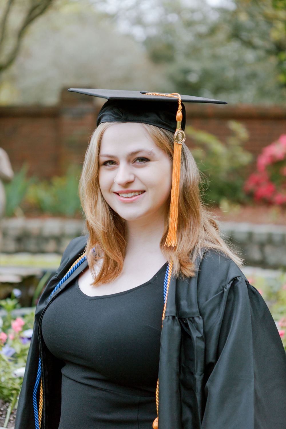 College graduate smiles at camera, Augusta, GA