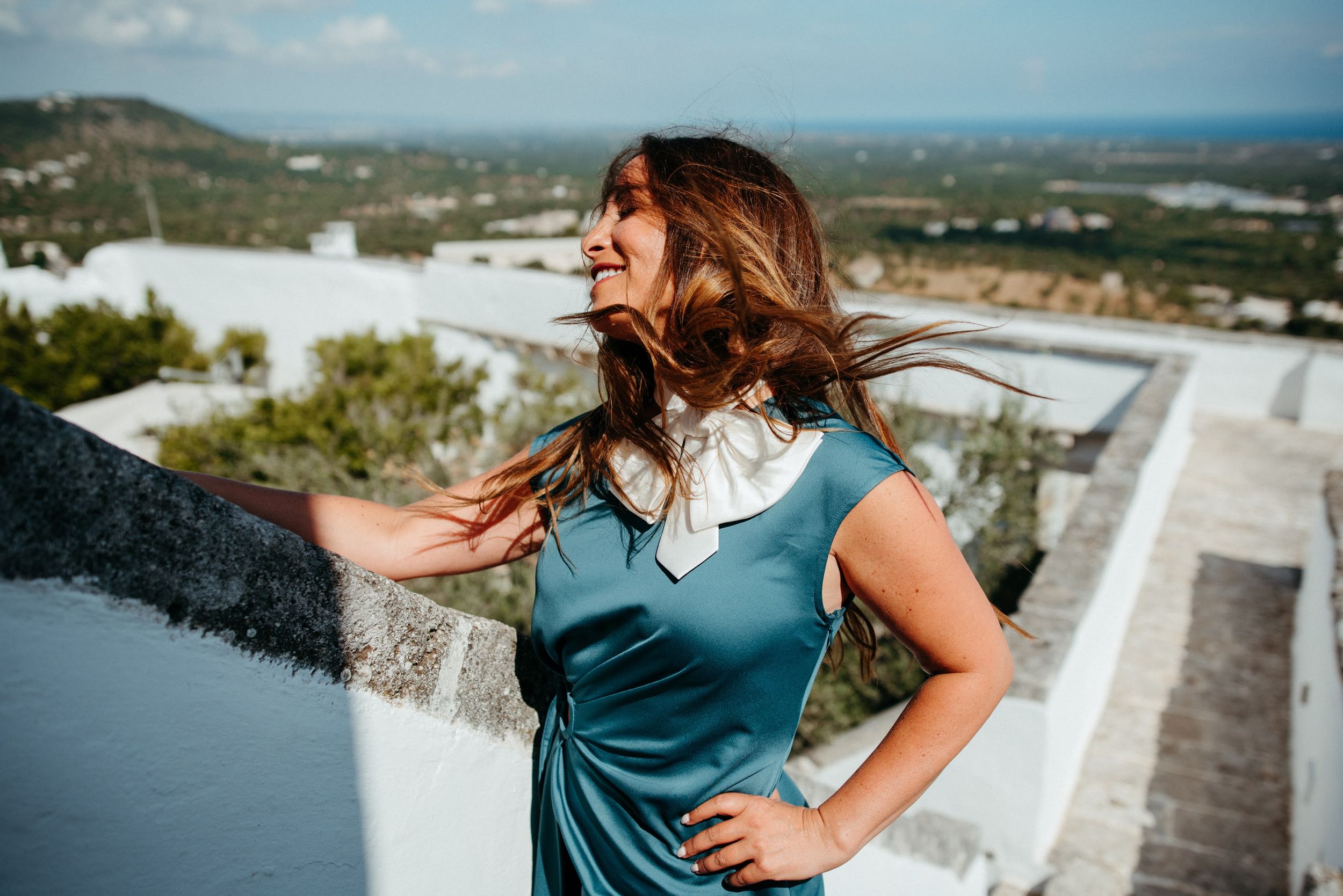 Scenic hilltop views of Mediterranean landscape with traditional architecture.
