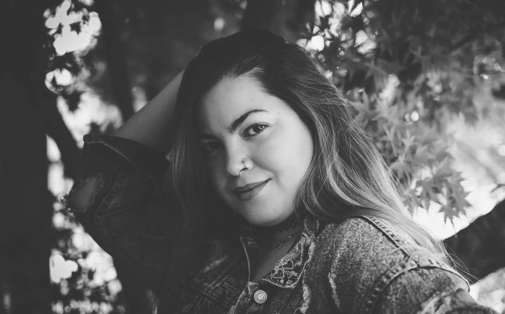 Moody black and white portraits with dramatic shadows and natural outdoor lighting.
