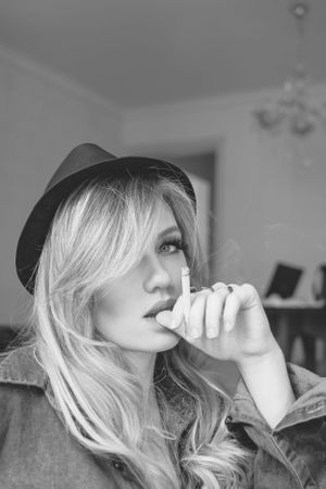 Black and white portrait series showing dramatic angles and lighting.