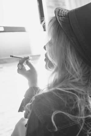 High contrast black and white photographs capturing silhouettes against window light.