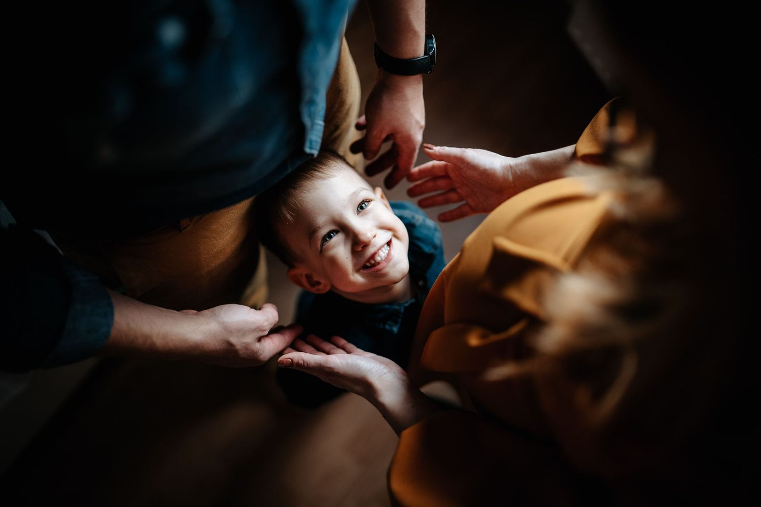 Joyful playtime captured in a candid closeup shot with warm lighting.