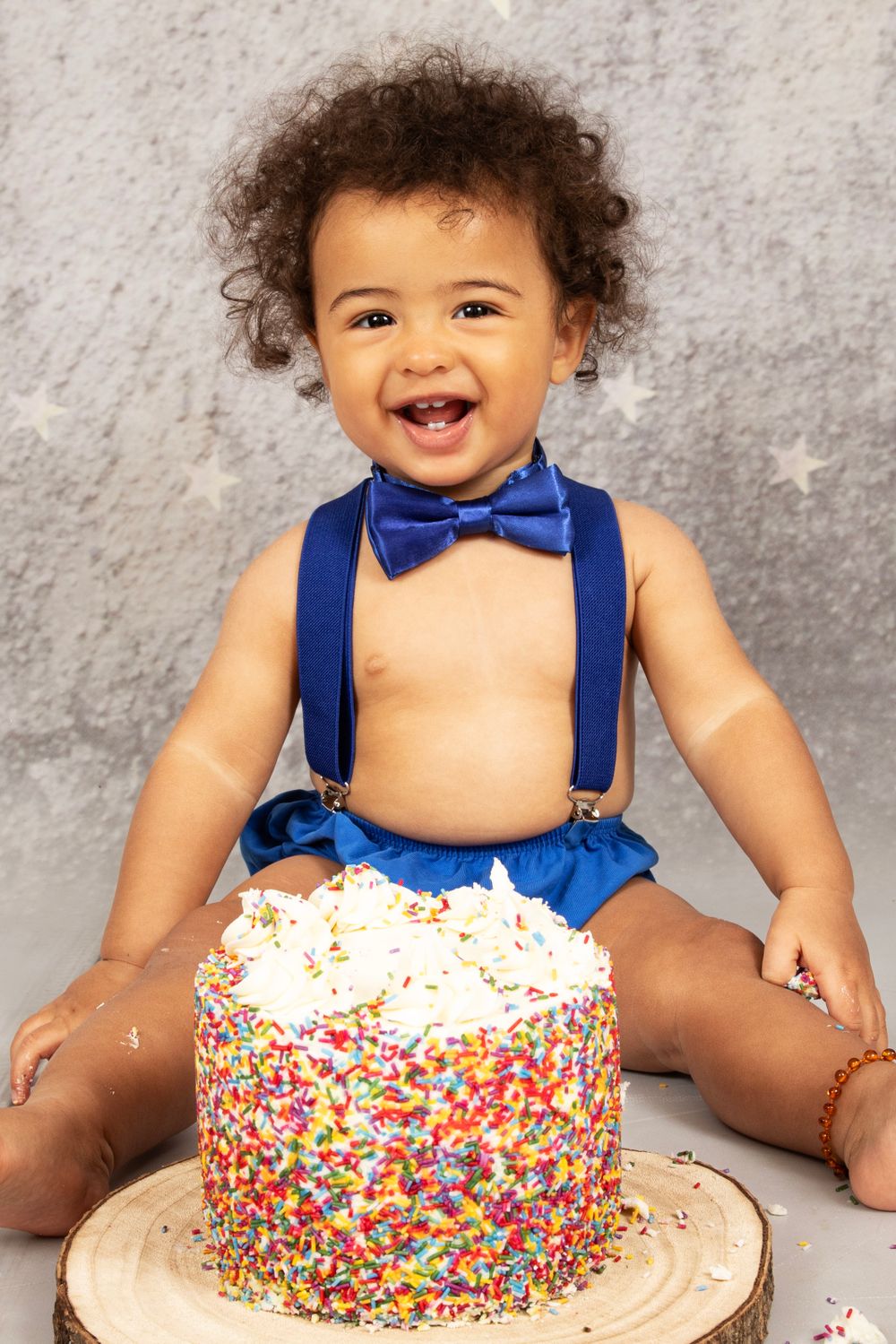 Boy smiling with cake.