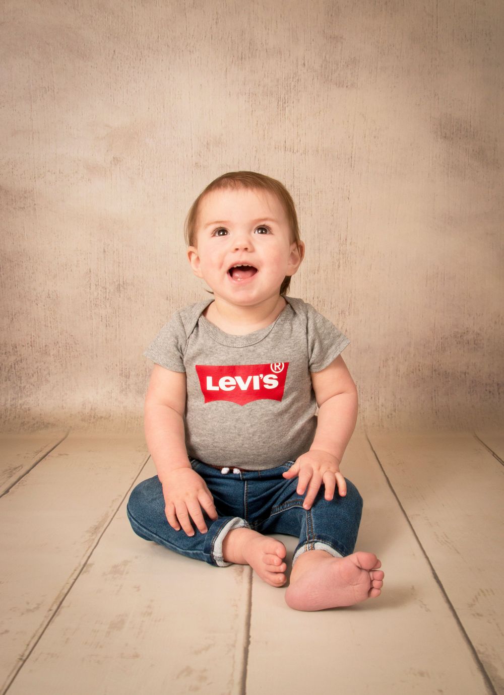 Boy portrait, wearing Levi baby grow.