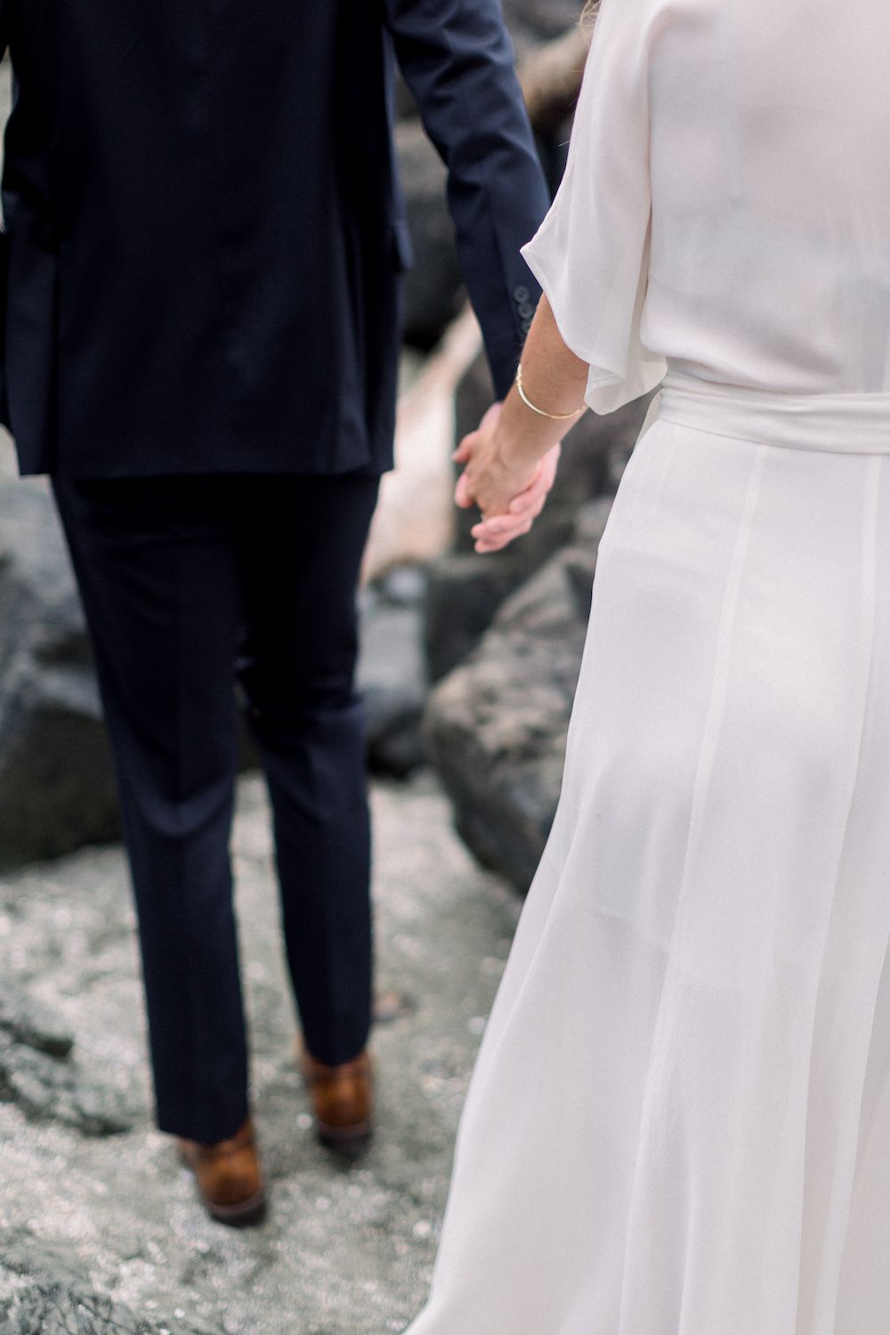Holding hands after the elopement ceremony.