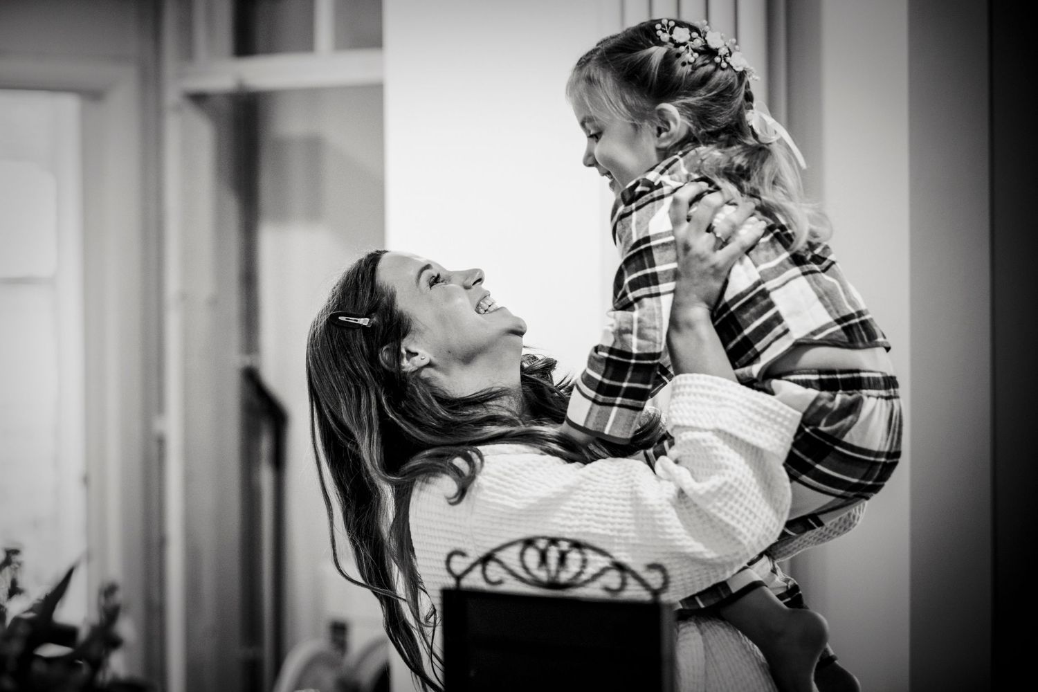 Series of black and white intimate portraits showing joyful expressions.