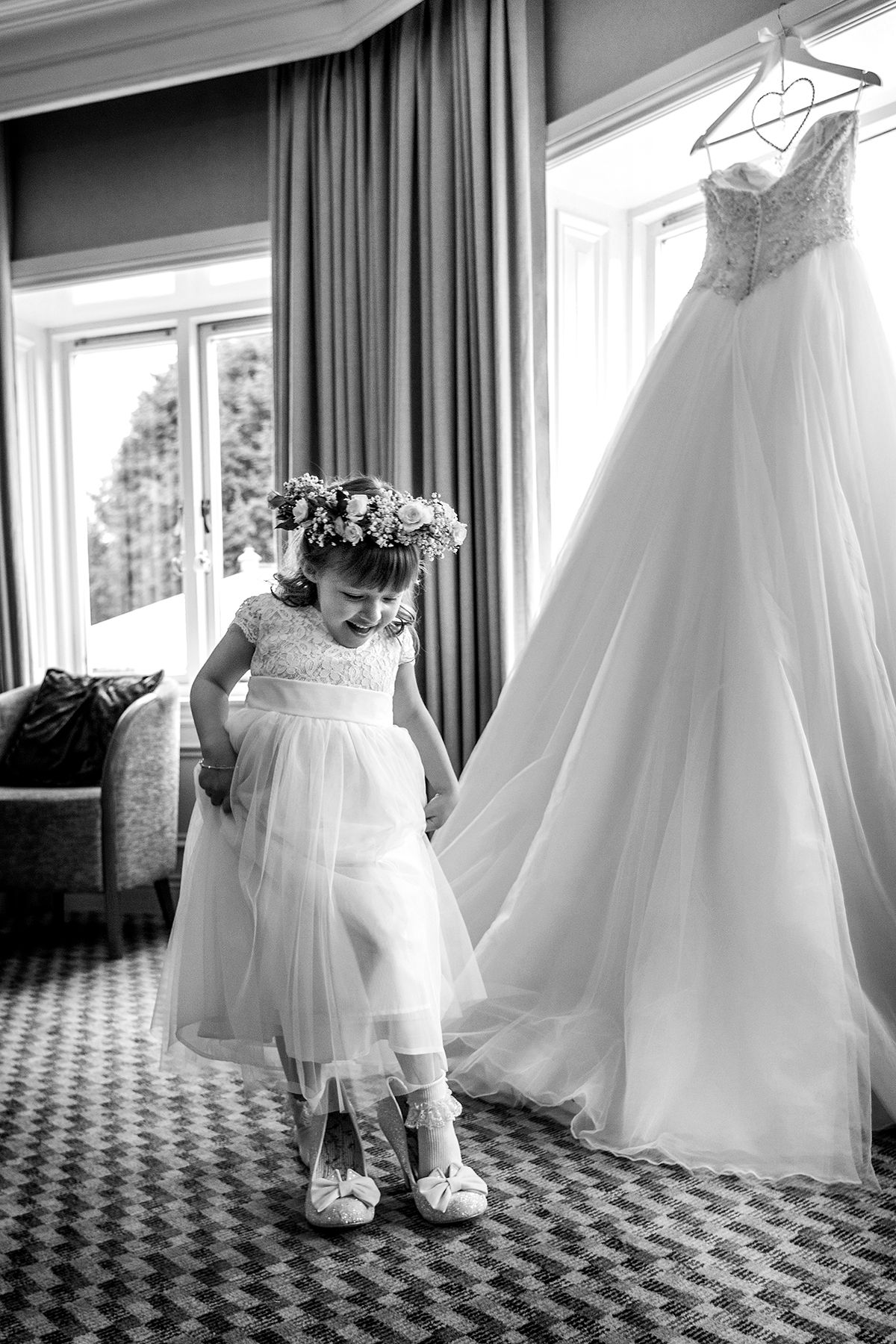 small bridesmaid trying brides shoes on at quorn country hotel