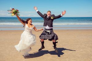 wedding couple having fun on the beach