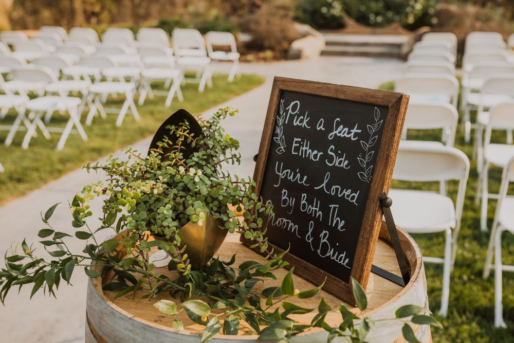 Wedding decor featuring rustic wooden elements and white floral arrangements.