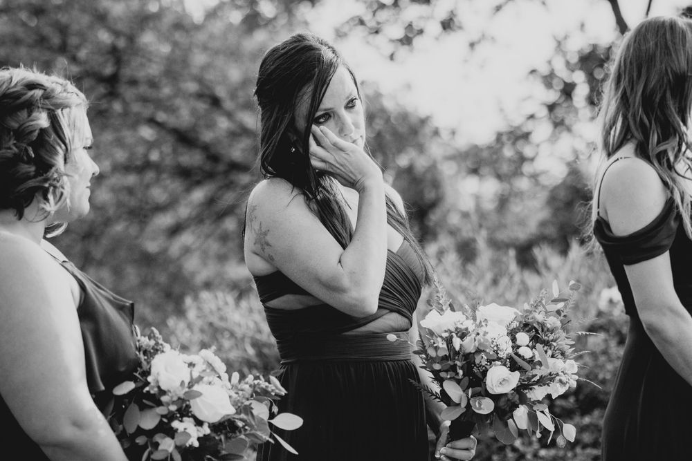 Black and white candid shots of emotional wedding ceremony moments.