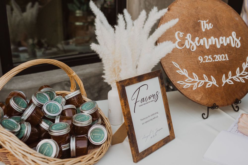 Wedding reception details featuring rustic decor and personalized favors.