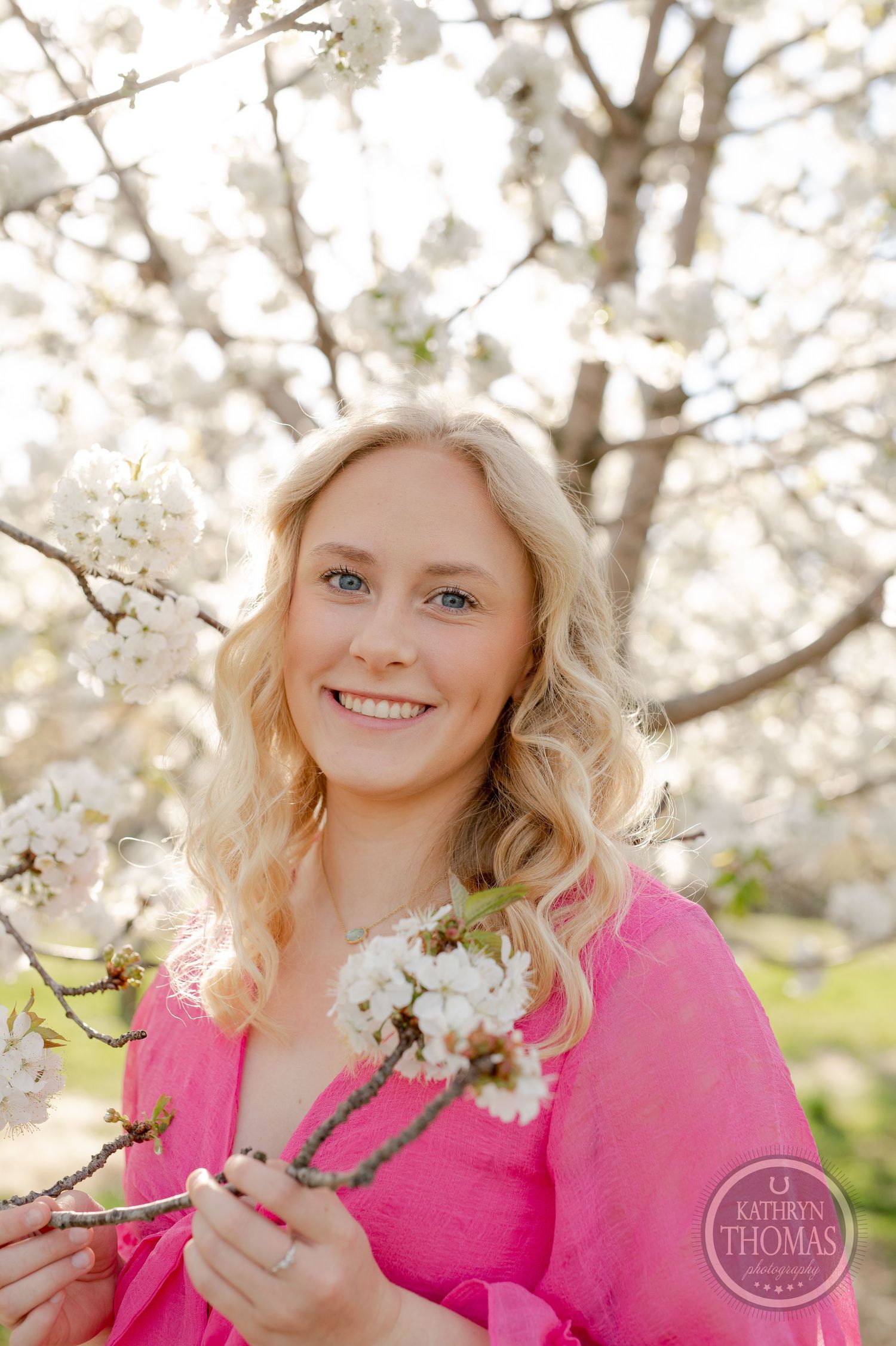 Spring portrait with beautiful white cherry blossoms and soft natural lighting.