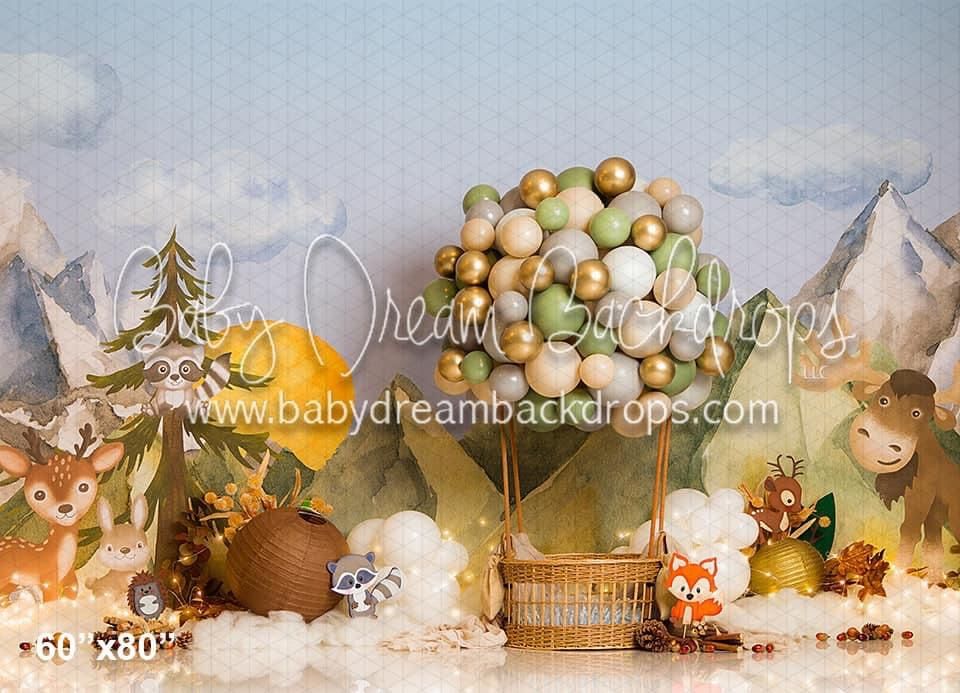 Whimsical woodland scene with hot air balloon basket, autumn leaves, and mountain backdrop in soft pastel tones.