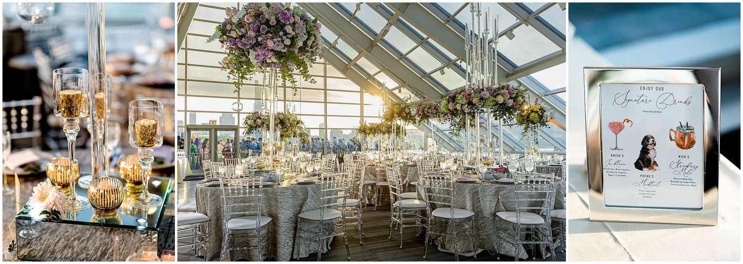 Elegant wedding reception setup in a glass conservatory with hanging floral arrangements and white table settings.