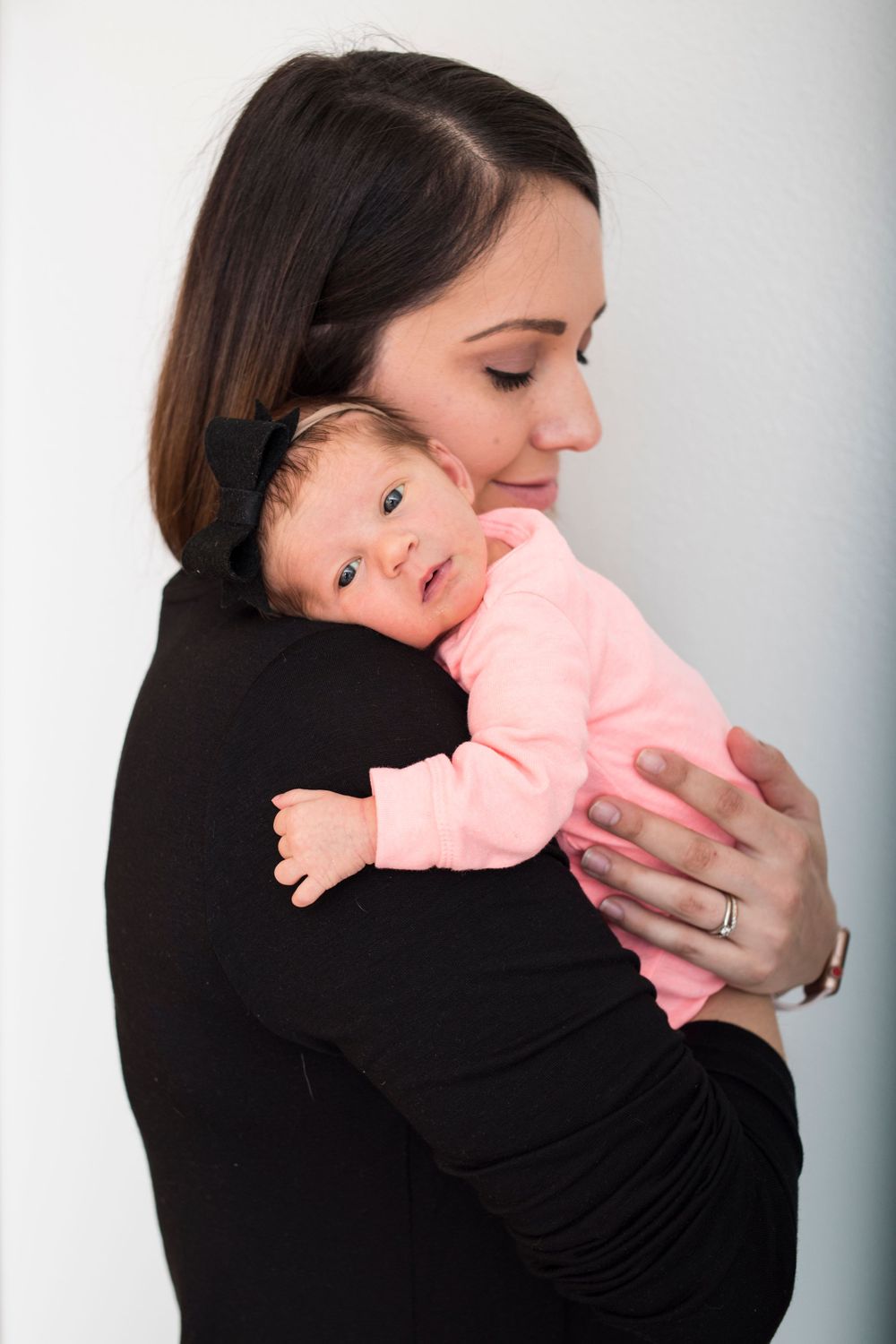 Mother holding newborn daughter