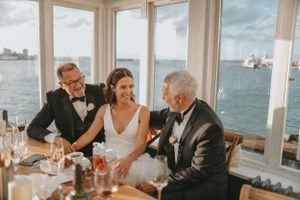 Elegant waterfront wedding reception with panoramic views of the harbor.