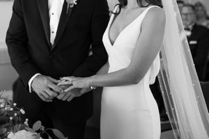 Black and white photograph of intimate wedding ceremony moments.