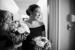 Black and white wedding photography capturing intimate moments before the ceremony.