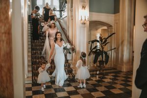 Elegant wedding venue interior with marble columns and classic architectural details.