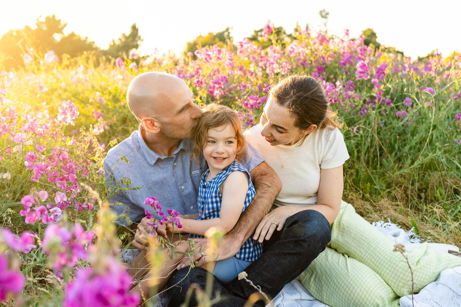 Family sitting on a blanket at the wildflower field in Seattle.