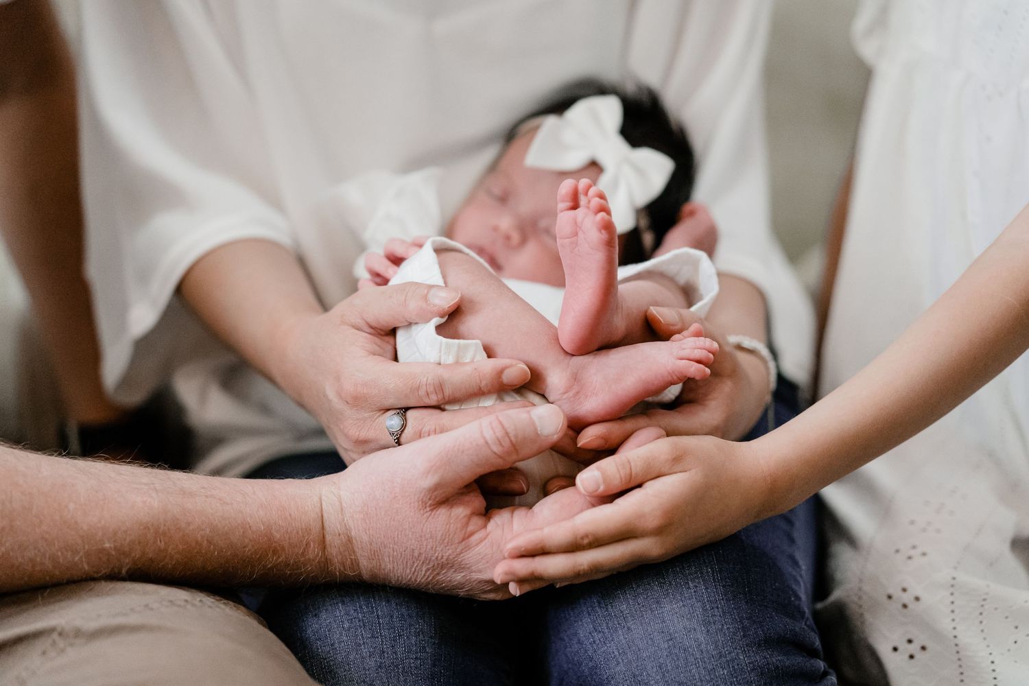 Family holding newborn girl