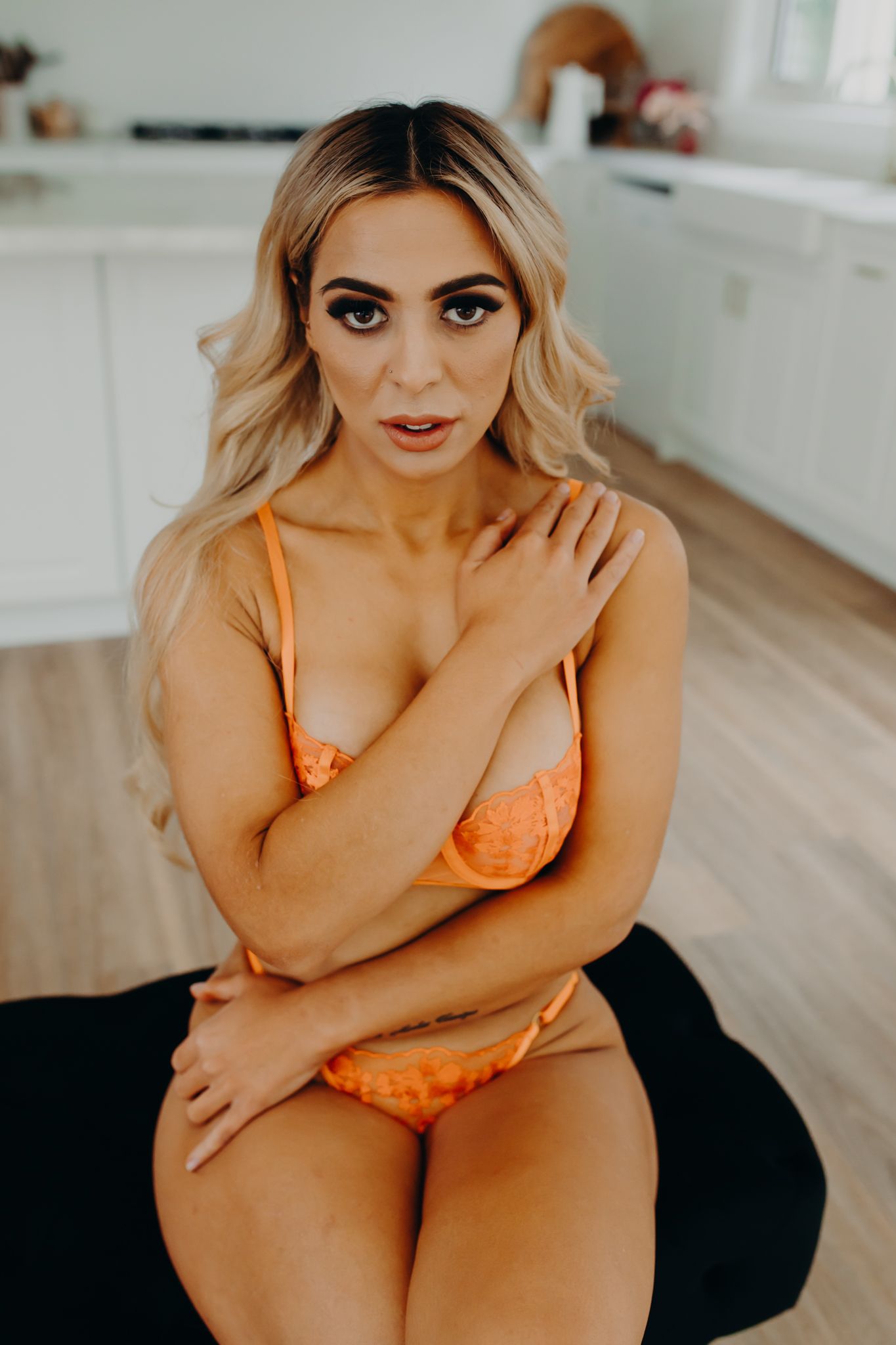 Close up portrait against white kitchen interior background.