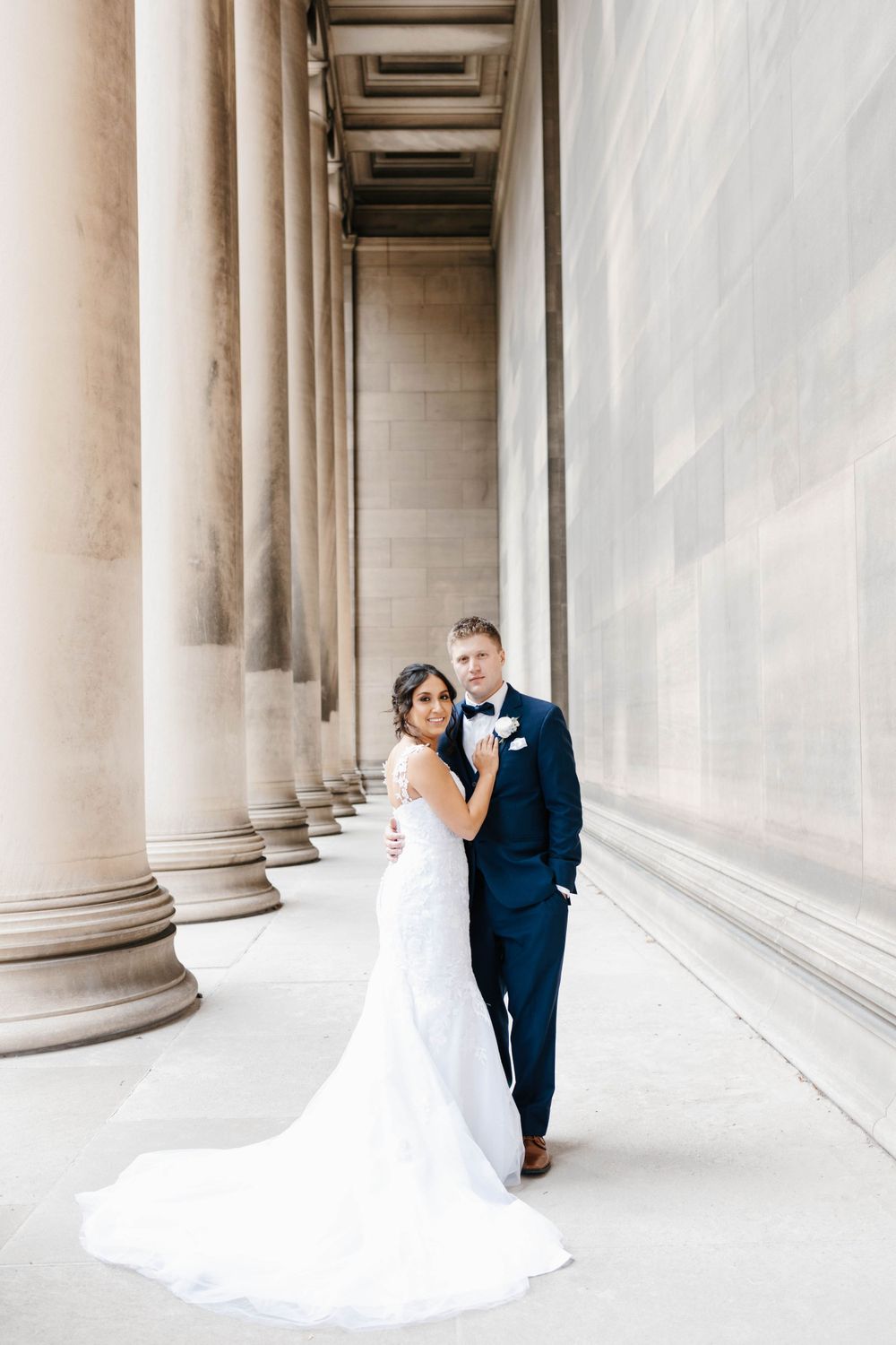 Bride and groom in classic portrait with Pittsburgh columns
