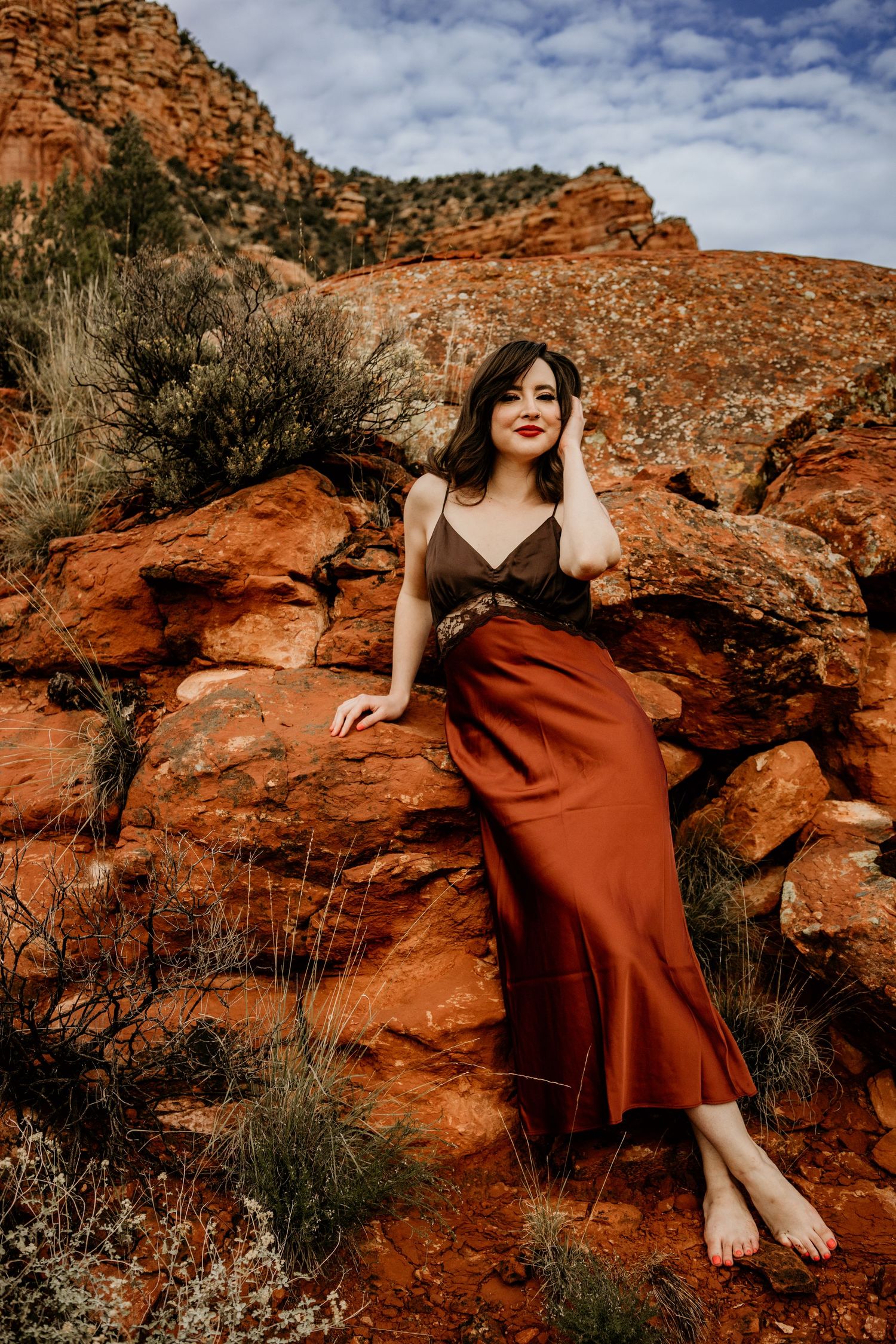 Red rock formations create dramatic backdrop for desert landscape in Sedona.