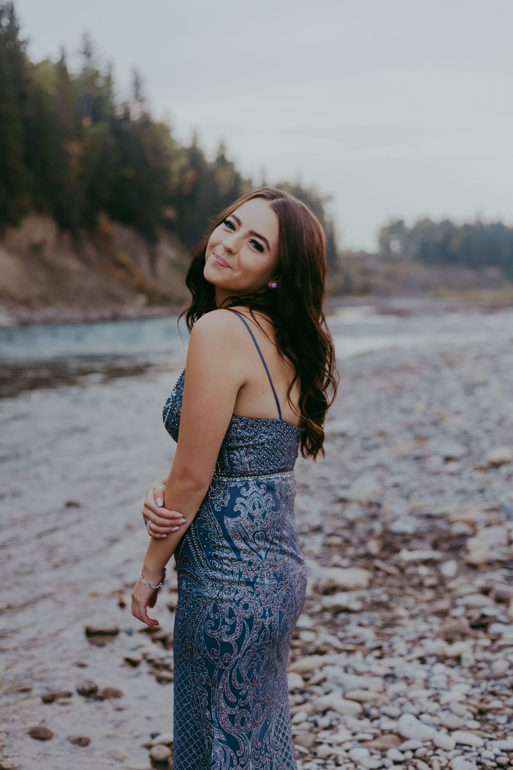 Girl in purple dress smiles at camera