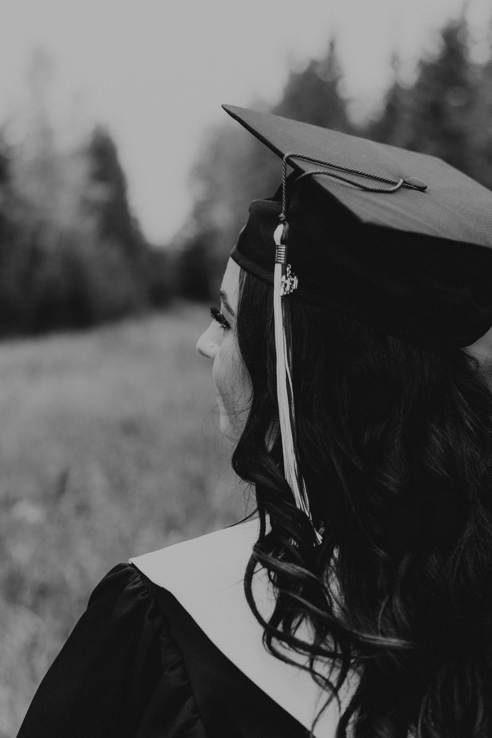 Black and white portrait of girl in cap and gown