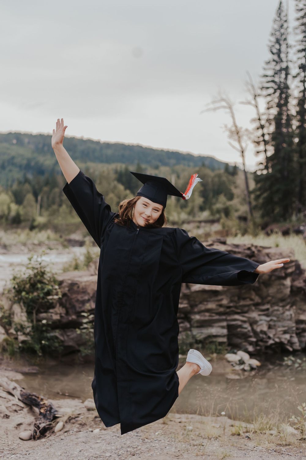 Graduate jumps while wearing cap and gown
