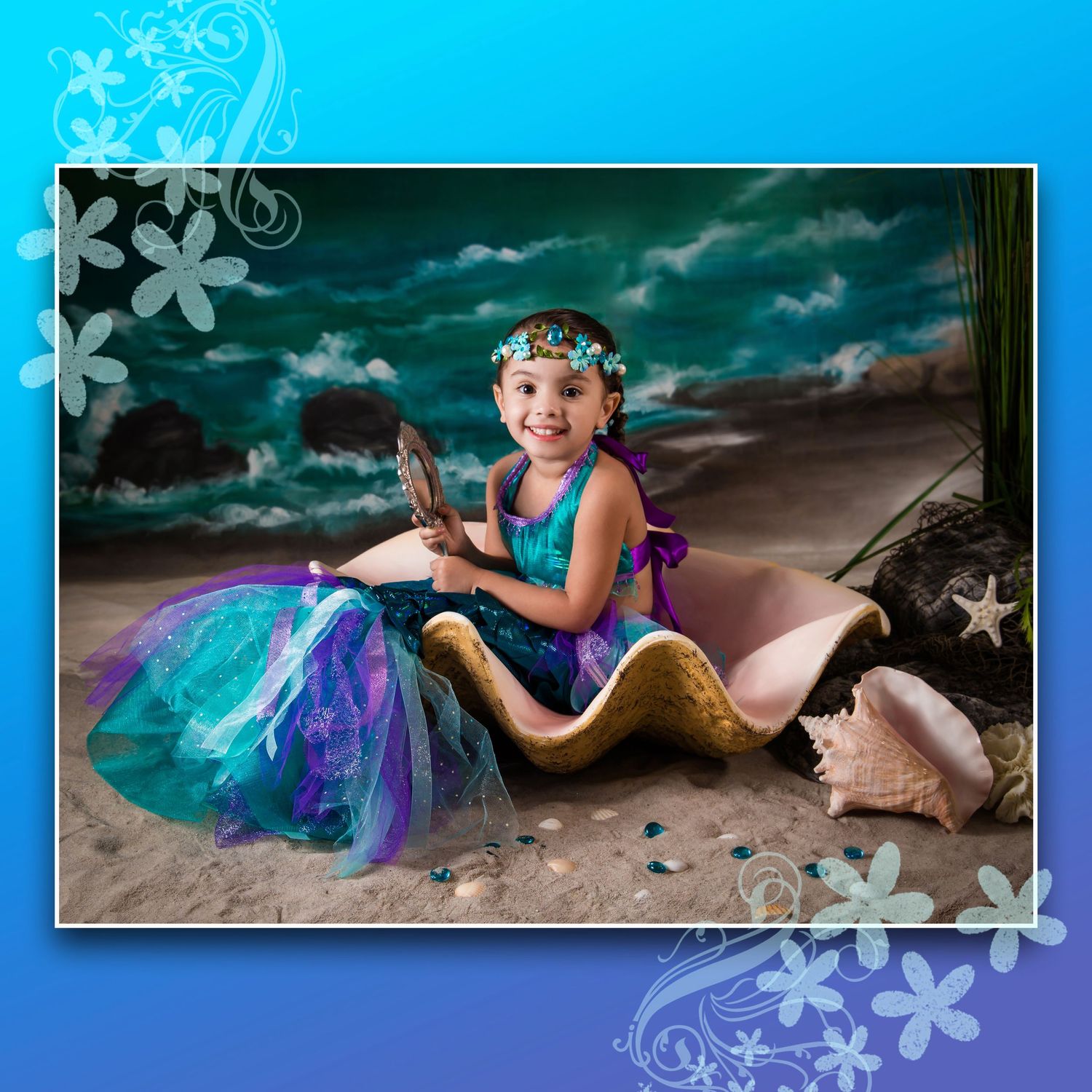 Mermaid-themed photo collection with blue snowflake borders and ethereal beach backdrop.