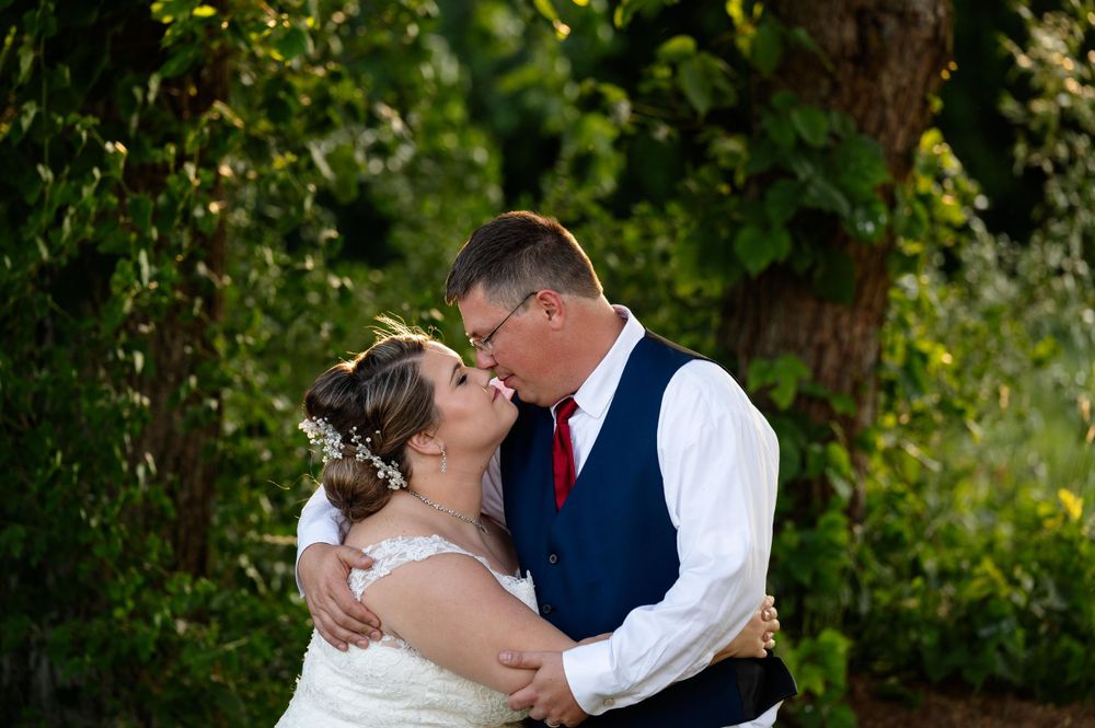Couple sharing an intimate moment outdoors during their wedding photoshoot.
