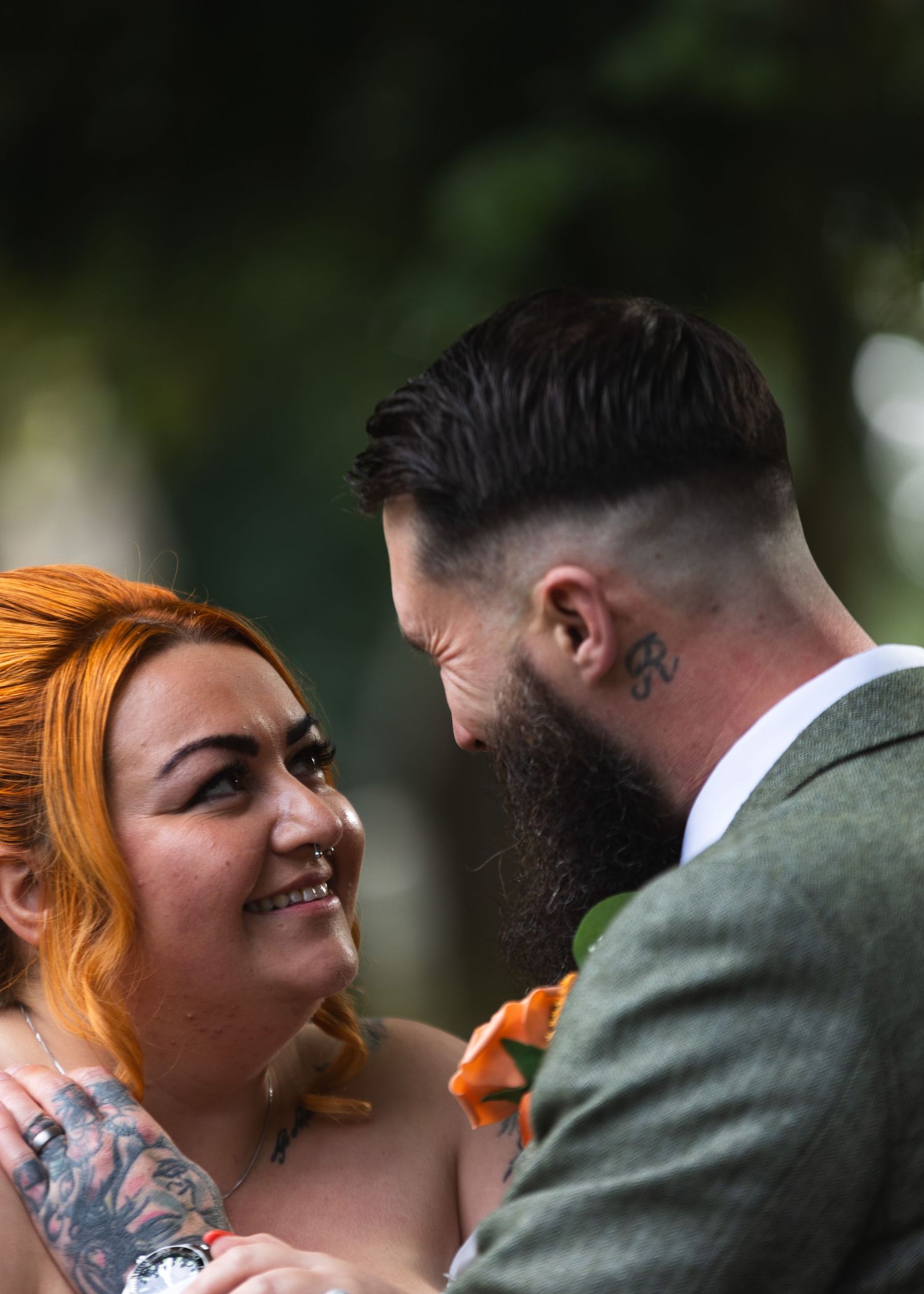 A romantic moment captured between a couple during their wedding celebration.
