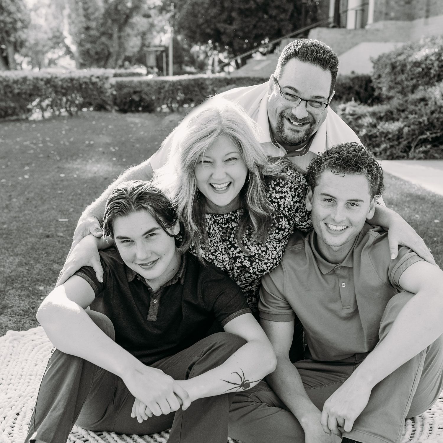 Dad hugging his family from behind