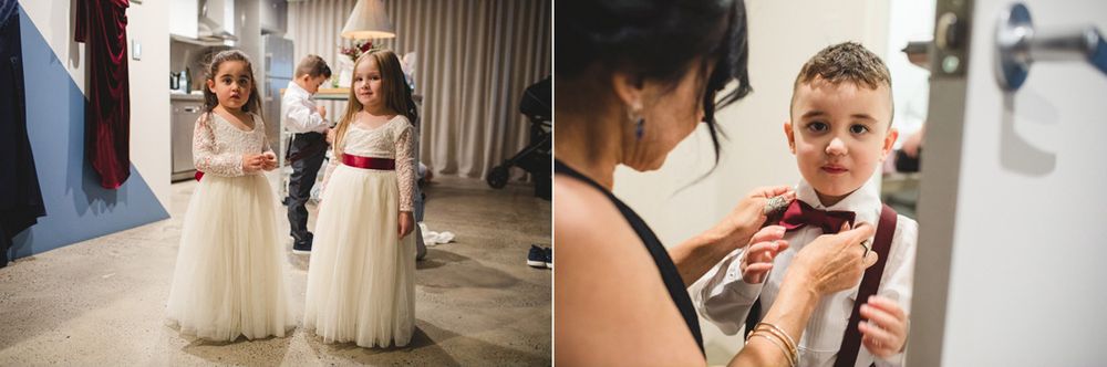 Wedding party members getting ready in a bright indoor space.