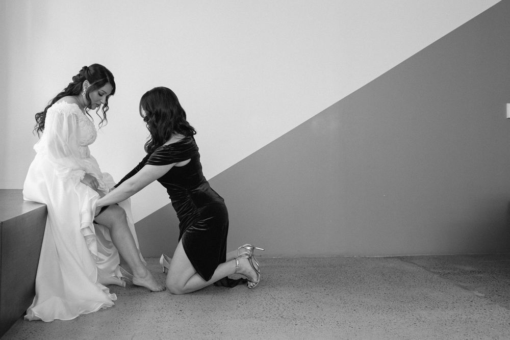 A sequence of artistic black and white bridal portraits showing movement and flowing fabric against a minimalist background.