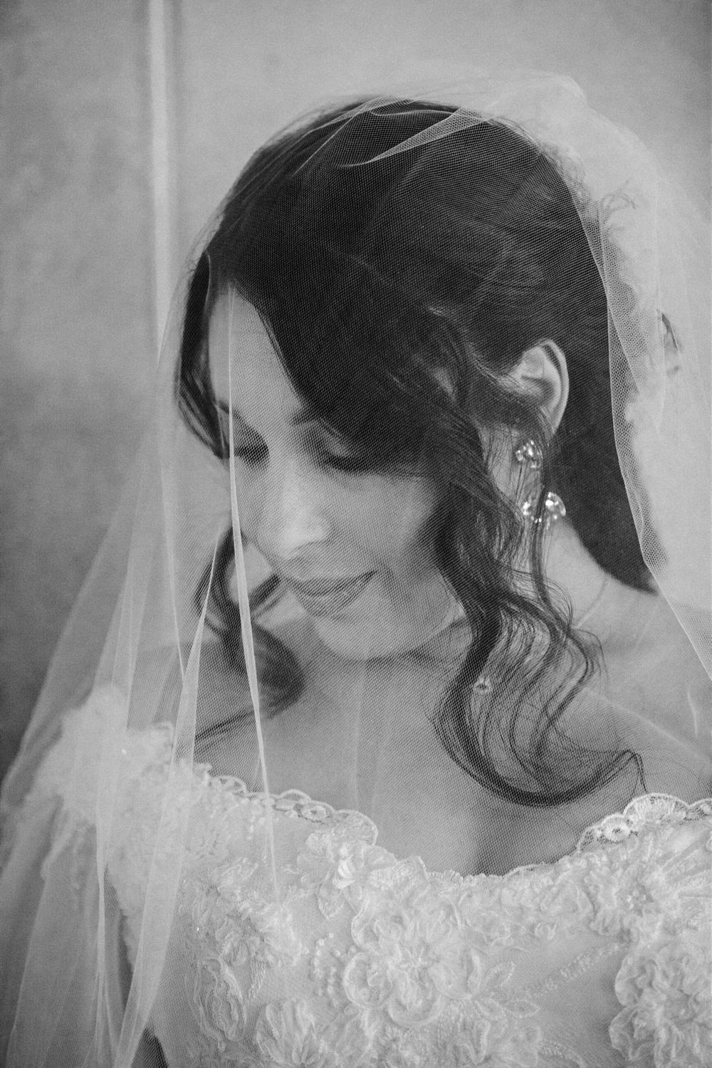 Black and white close-up series showing delicate details of a bridal veil and lace.