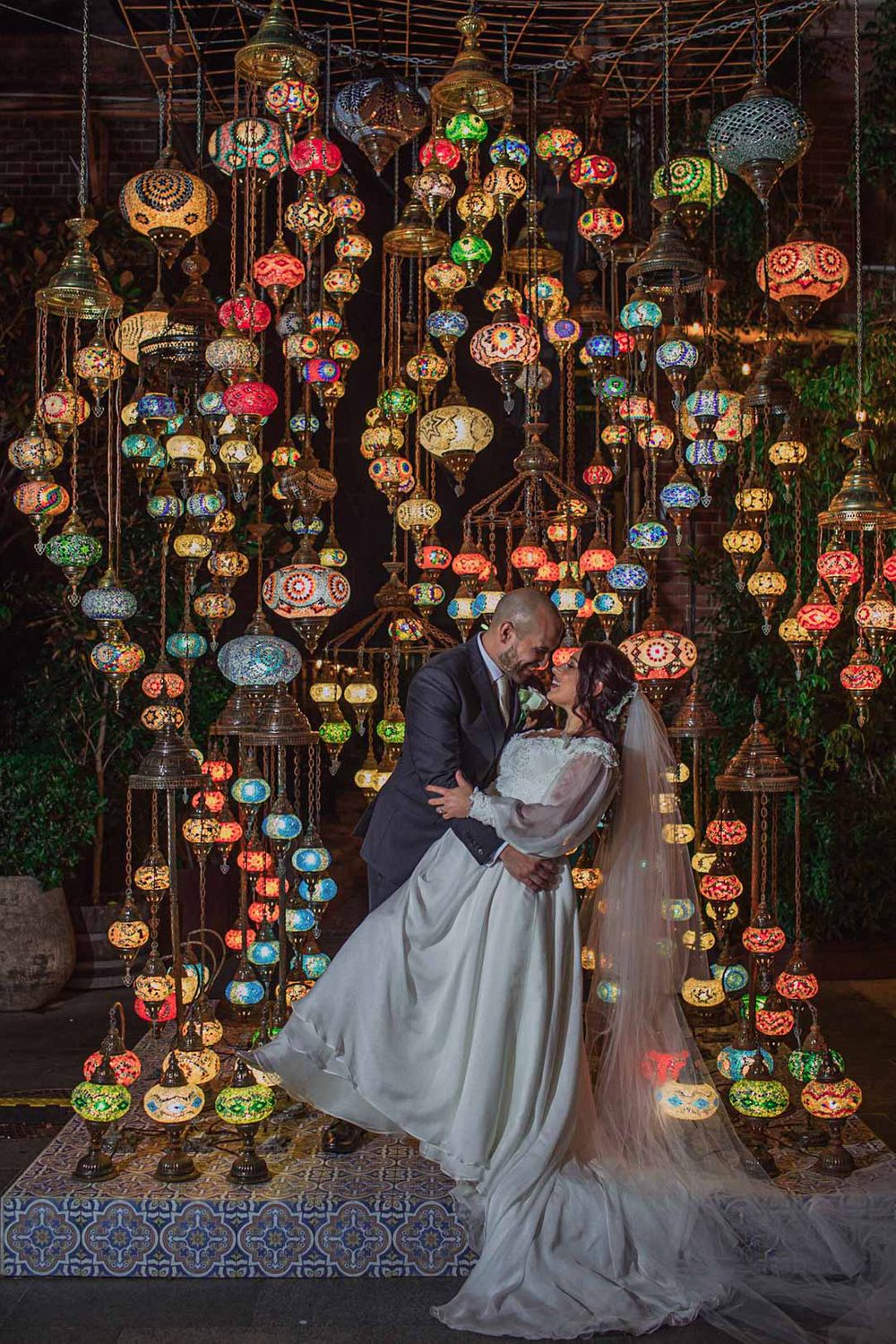 Colorful Turkish mosaic lanterns create magical ambiance at wedding reception.