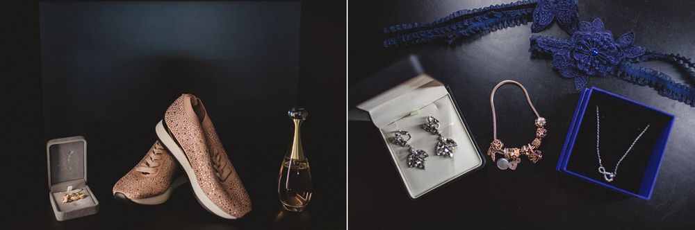 Wedding accessories including jewelry, rings, and decorative items arranged on dark surfaces.