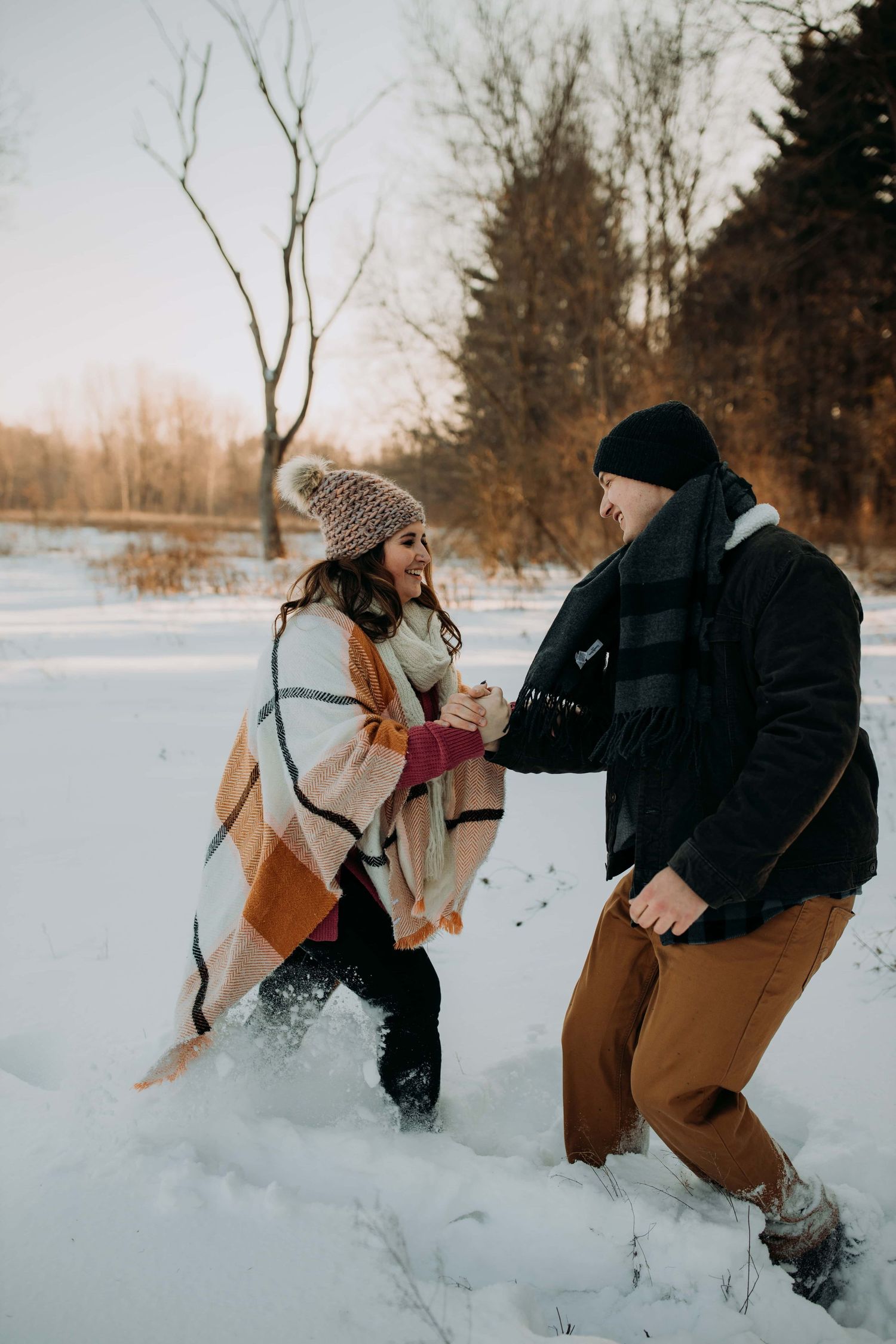Couple-wrestling-in-snow