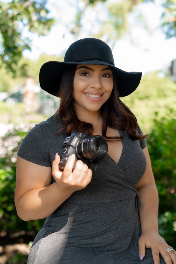 Lifestyle portrait with wide-brimmed hat in natural sunlight.