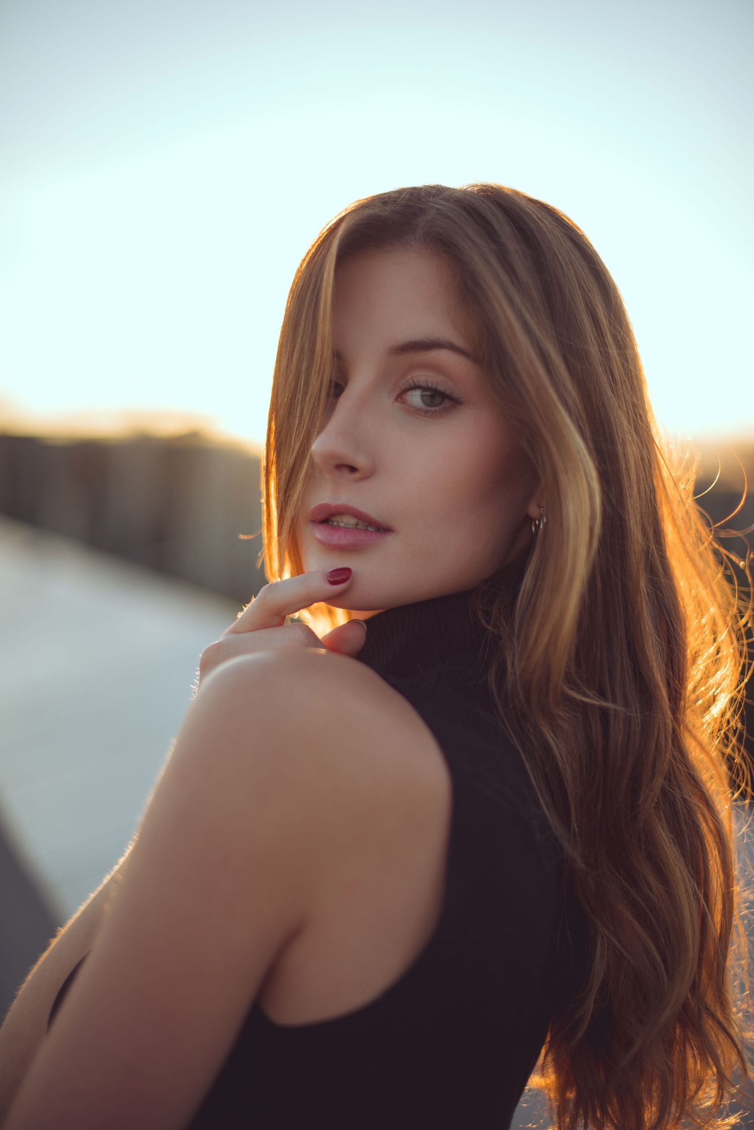 Elegant girl posing for a photo shoot during sunset in Budapest, Hungary